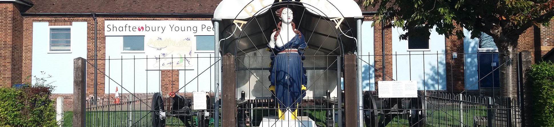 Front view of figurehead enclosed by metal railings
