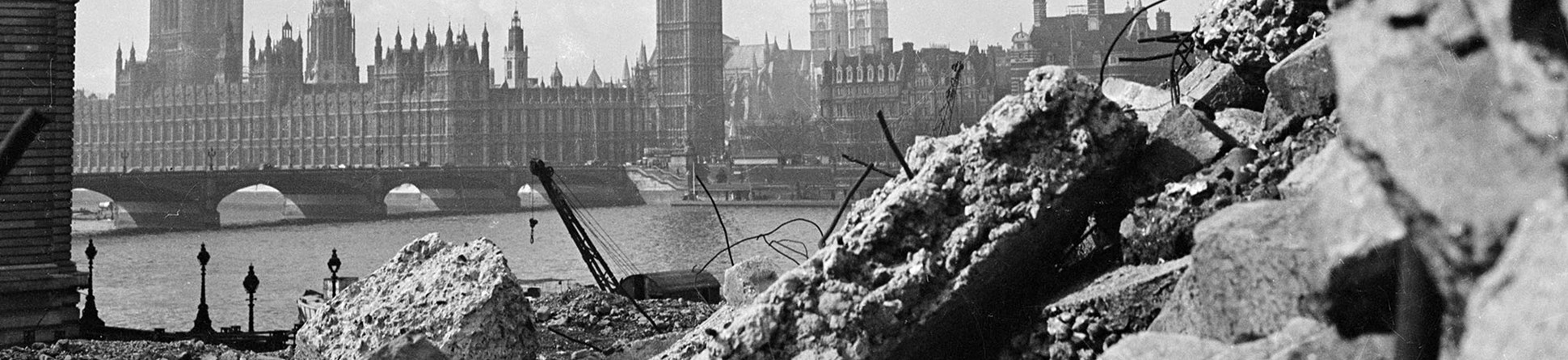 View of Big Ben and the Houses of Parliament through rubble in the foreground
