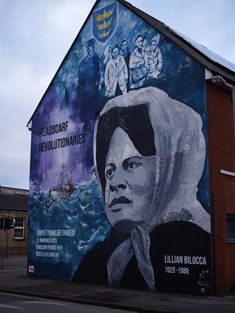 Headscarf Revolutionaries mural on side of a building