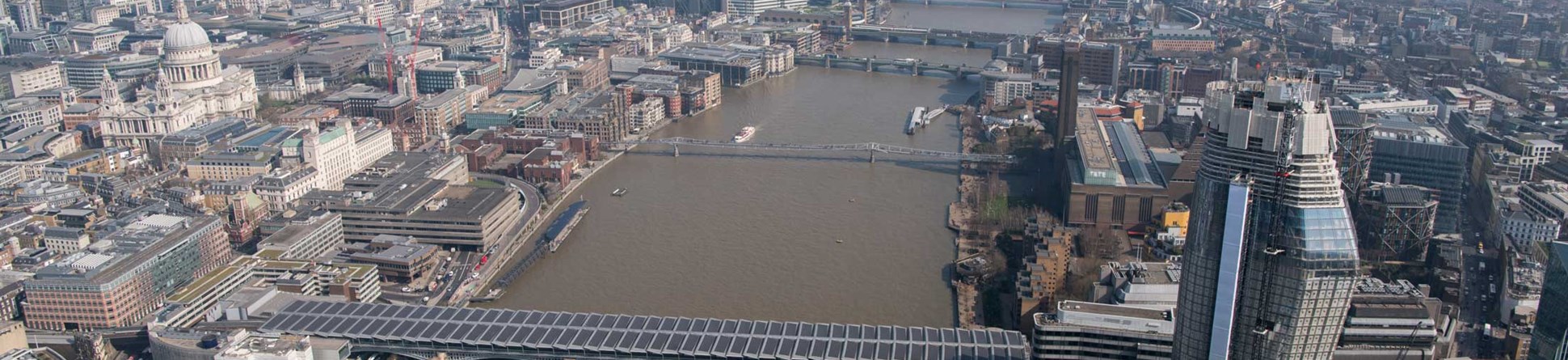 An areal view of central London along the Thames including St Pauls.