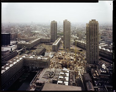 A colour photo of the Barbican arts centre in the centre from a high vantage point.