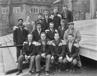 A group of male Laing employees pose for a group photo.