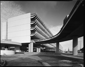 A black and white photograph of the Preston Bus Station showing the large car park building.