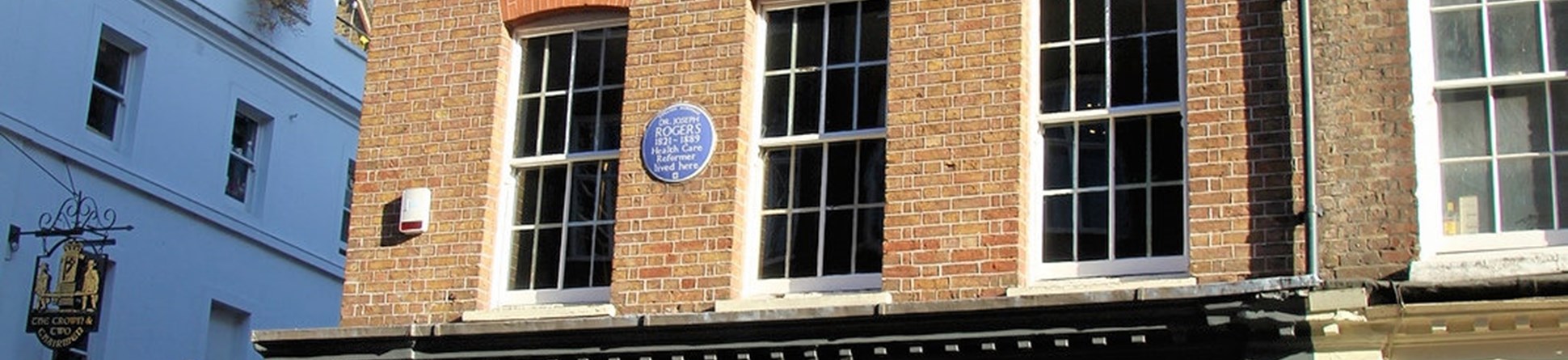 Georgian building with blue plaque dedicated to Dr Joseph Rogers, health care reformer who lived there 1821 to 1889.