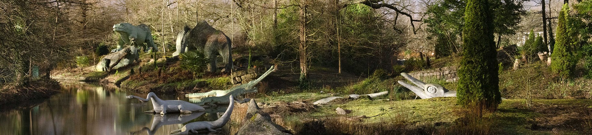 General view of dinosaurs along the lakeside