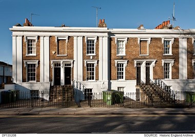 Terraced houses in Woolwich, London, with gated and paved front areas.