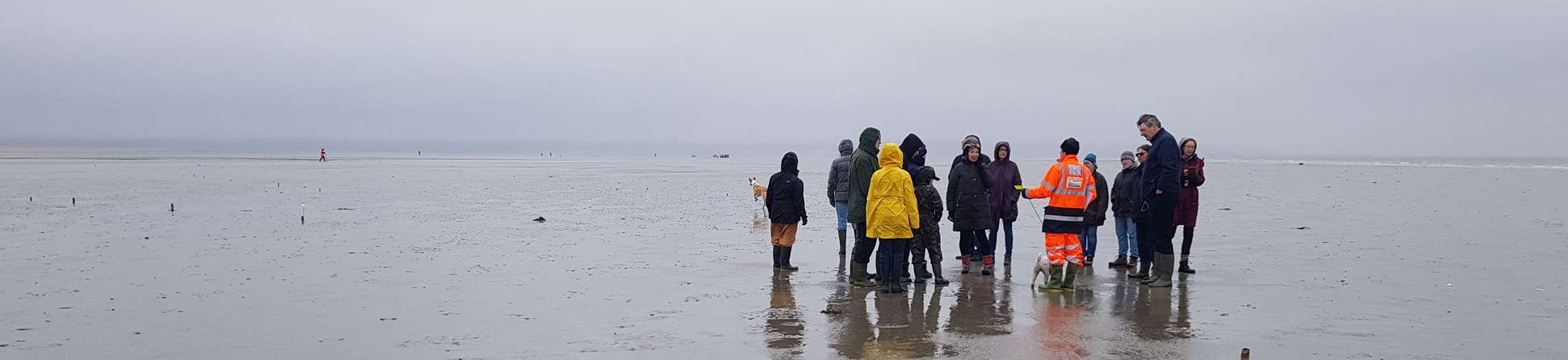 Image of group of people on the beach at Sandwich Bay, Kent.