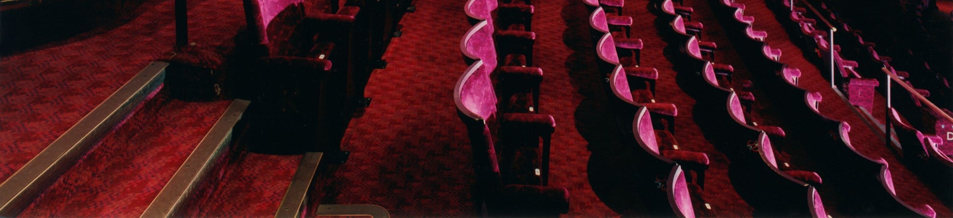 Interior of Prince Edward Theatre, London.  View of auditotrium at dress circle level, across seating showing rake. 