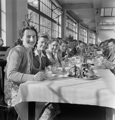 A group of people having lunch at a long table