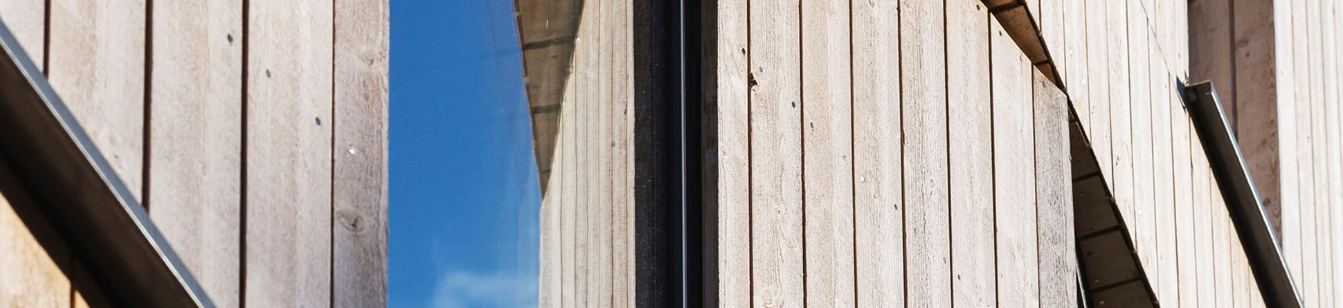 Detail of exterior wooden wall panelling and window