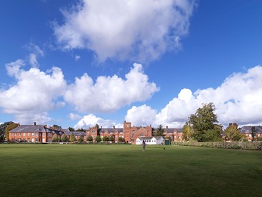 A view over grounds to a redeveloped former Victorian hospital complex.