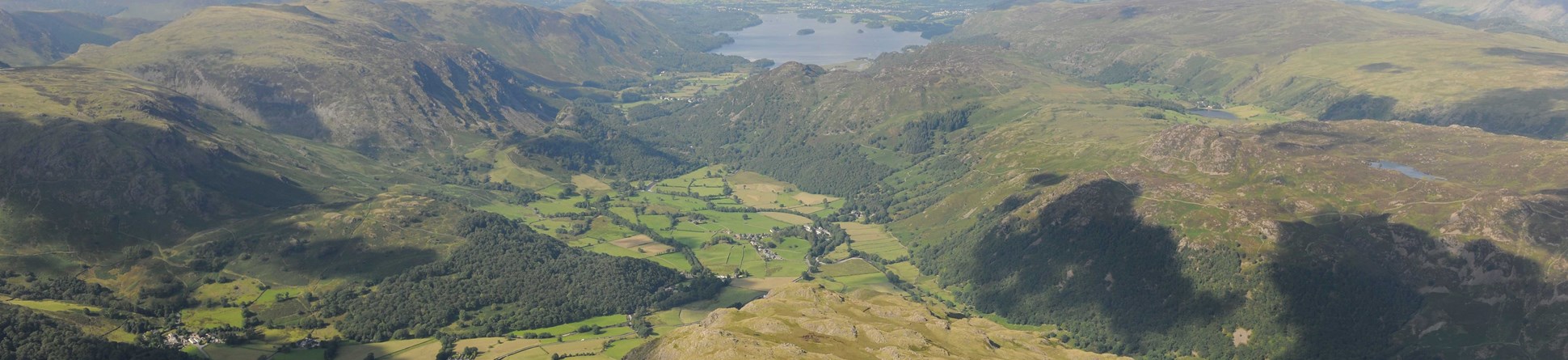 Aerial view of Rosthwaite Fell with Derwent Water and Bassenthwaite Lake in the distance.