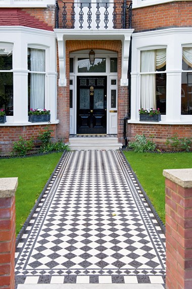 A Victorian geometric tiled pathway.