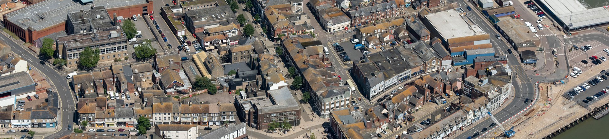Aerial view of Lowestoft town with dock areas bottom right and top right.