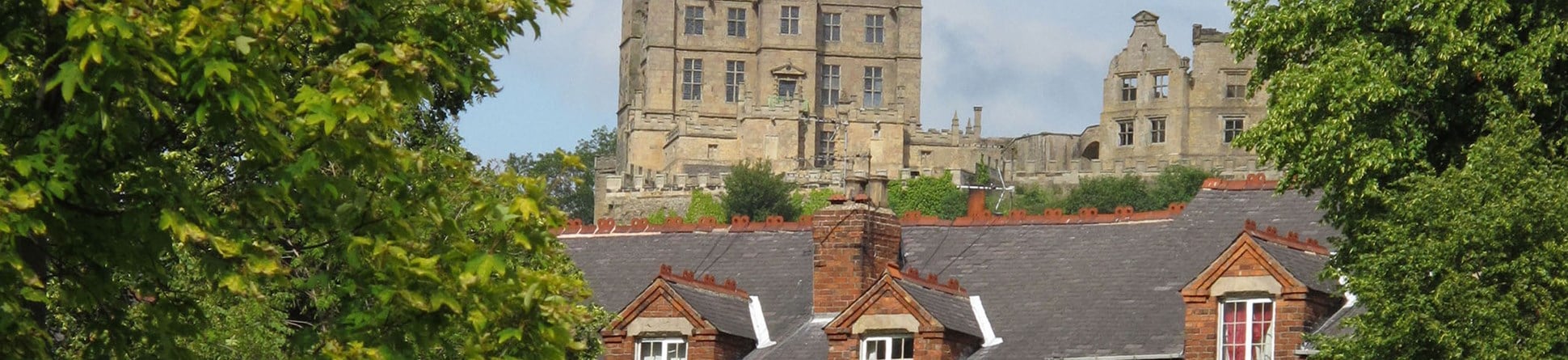 New Bolsover Model Village, Derbyshire, where much of Historic England’s research into energy performance and the effects of measures to increase energy efficiency is being carried out. Bolsover Castle is visible in the background