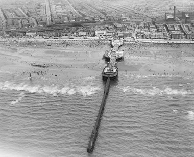 Central Pier, as it has been known since 1930, was designed by John Isaac Mawson and constructed by Laidlaw’s who had also built Blackpool’s first pier. This Aerofilms photograph was taken in 1920 before the long jetty was removed.