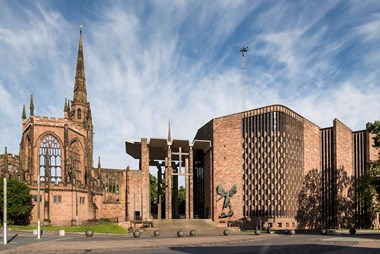 Coventry Cathedral, east elevation to Priory Street with the new porch and Lady Chapel of the old cathedral.  Jacob Epstein's bronze of St. Michael and the Devil on the wall of the babtistery