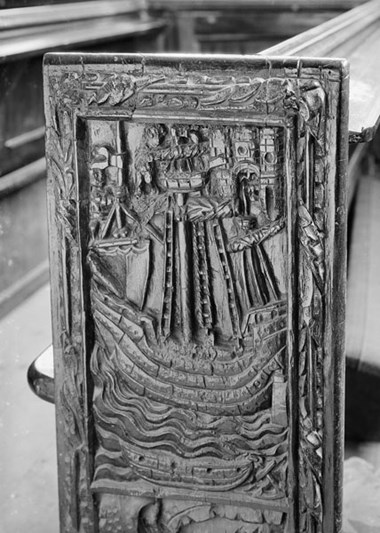 A medieval bench end from All Saints, East Budleigh, Devon, depicting a 16th-century armed vessel