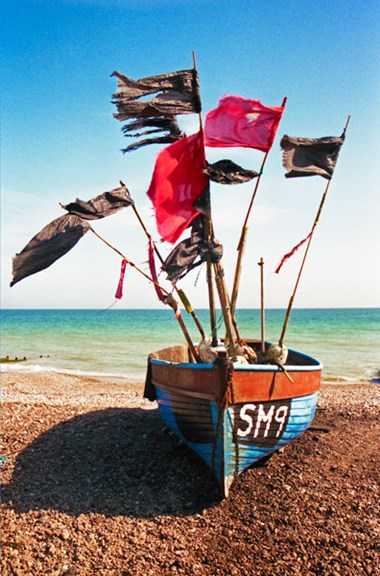 A small fishing boat on the beach at Worthing, West Sussex