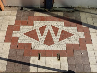 Monogrammed Carter’s tiles on the lobby floor of Store 869, St. Ives, Cambridgeshire