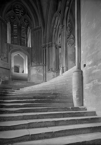 Archive photograph of Wells Cathedral interior with steps leading in multiple directions