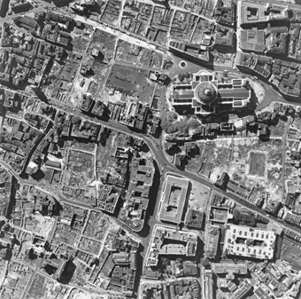 Archive vertical aerial photograph of St Pauls Cathedral amid flattened buildings