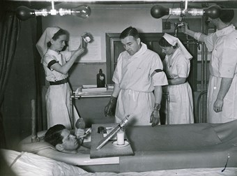 Patient resting and smoking in a saline bath after the dressings have been removed