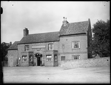 Archive photograph of vernacular buildings.
