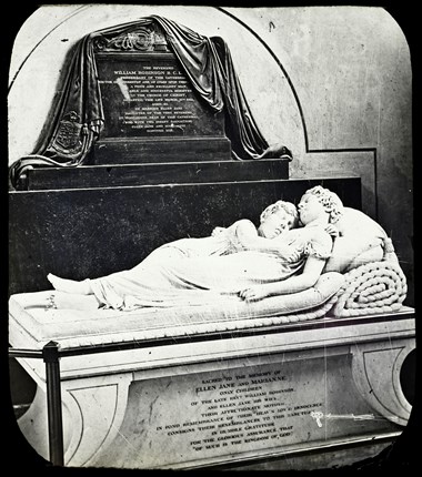 Archive photo showing a stome church monument with two recumbent figures.