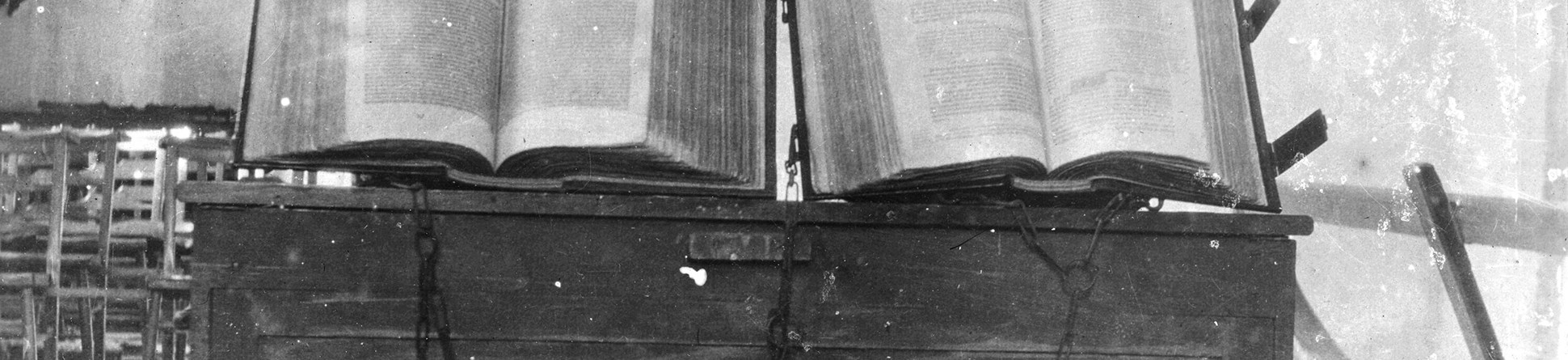 Two books chained to a desk inside St Michael's Church Blewbury, in 1909.
