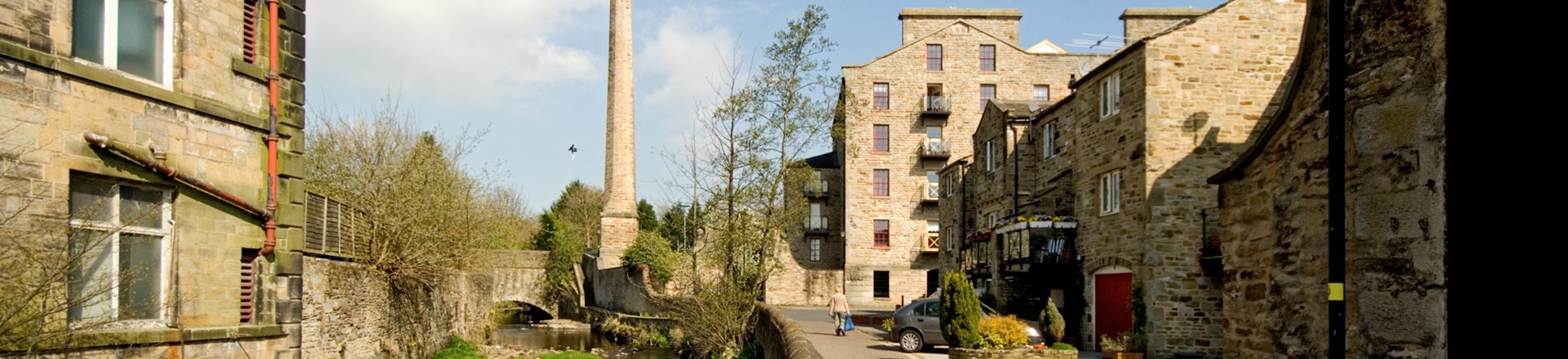 View along waterway to mill chimney and conversion, Skipton.