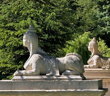 Sculpture of two sphinxes on stone plinthes
