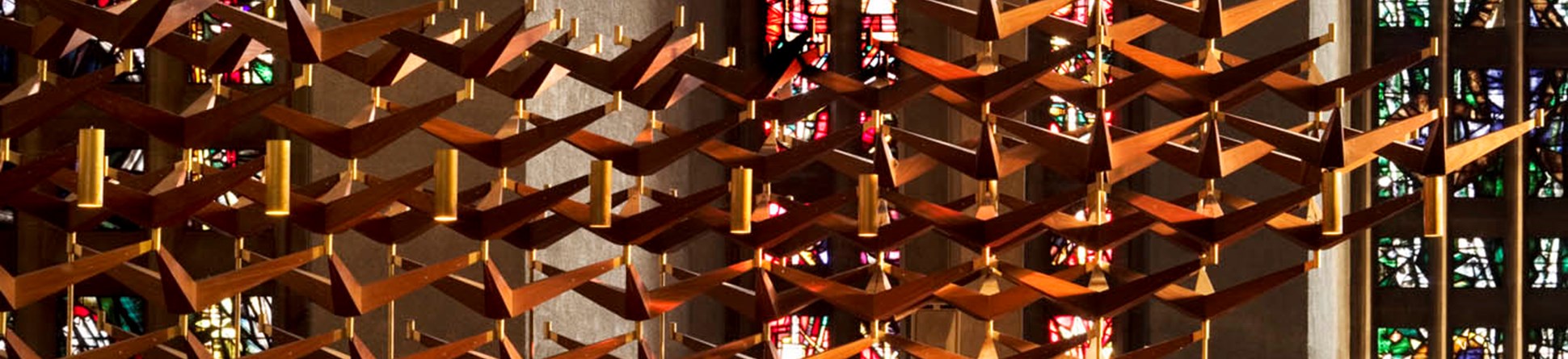 Detail of choir stalls and stained glass in Coventry Cathedral Church of St Michael