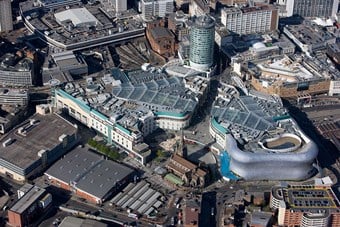 Colour aerial photo showing an urban centre with a mix of very modern buildings and more traditional brick built ones
