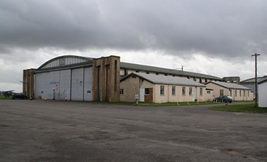 Old Sarum airfield, near Salisbury, Wiltshire. Rare survivor of a Training Depot Station repair hangar complete with attached workshops. Listed Grade II. CODE T/C. Private Collection