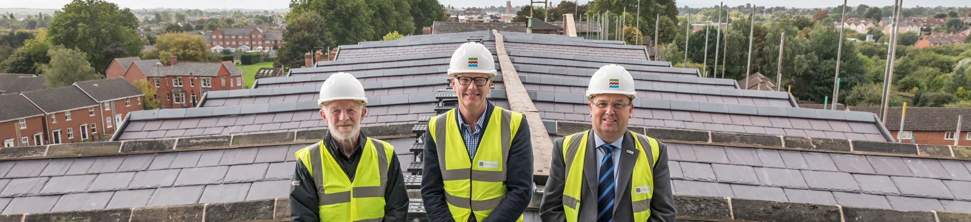 Shrewsbury Flaxmill Maltings new roof on the Main Mill. From left to right, Alan Mosley (The Friends of Flaxmill Maltings Chairman), Alastair Godfrey (Shrewsbury Flaxmill Maltings Project Lead), Nic Laurens (Shropshire Council, Portfolio Holder for Economic Growth).