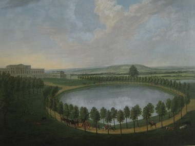 Painting of large lake surrounded by trees in parkland with a large house in the background