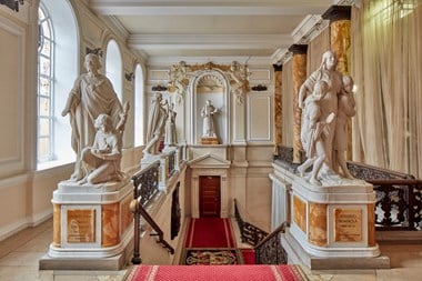 Statues adorning the staircase in Cardiff City Hall