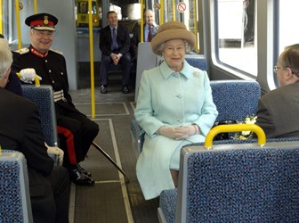 Queen Elizabeth II rides on the new Sunderland to Newcastle Metro Link after officially opening it at the Park Lane interchange, Sunderland, 7 May 2002 © PA Images / Alamy Stock Photo