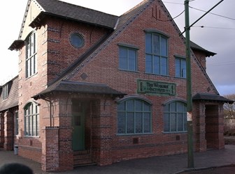 Modern colour photo of the red brick Workers Institute.