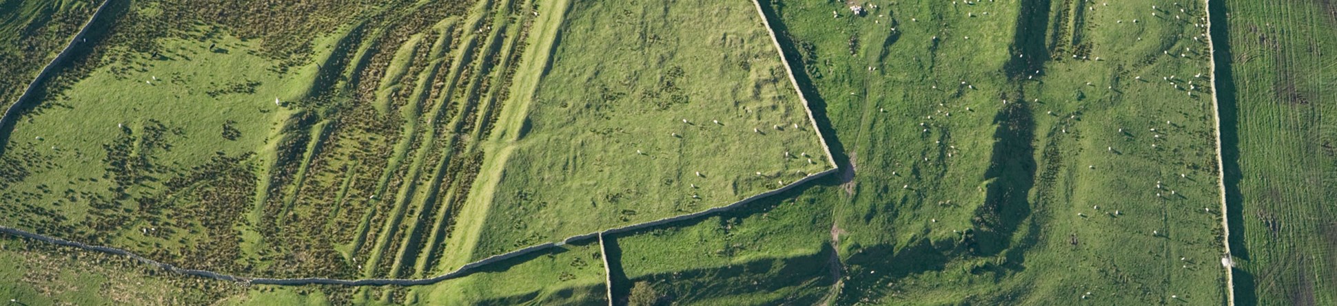 An aerial photograph of a Roman fort seen as earthworks.